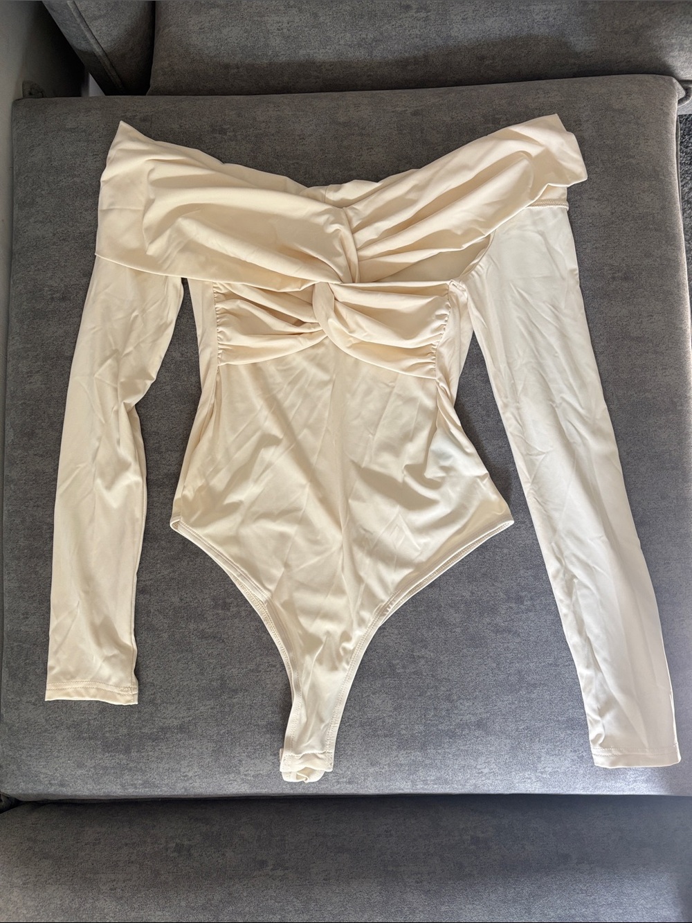 Anewsta Medium Off-Shoulder Twist Front Bodysuit in Cream strapless button thong